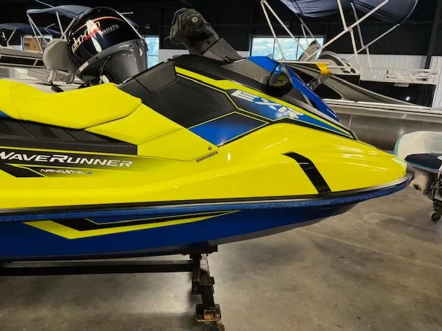 Slide: The Image of 2020 Yamaha WaveRunner EXR in vibrant yellow and blue, displayed indoors. - 10