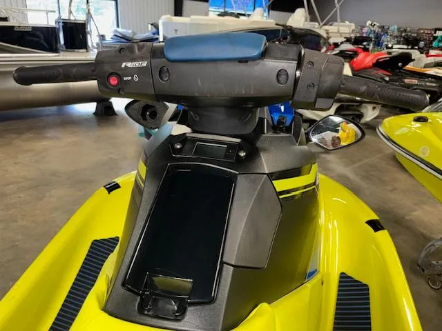 Slide: The Image of 2020 Yamaha WaveRunner EXR, yellow, in showroom with handlebars and dashboard visible. - 11