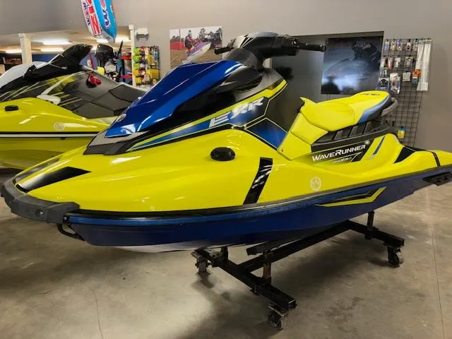 Slide: The Image of 2020 Yamaha WaveRunner EXR in vibrant yellow and blue on display indoors. - 3