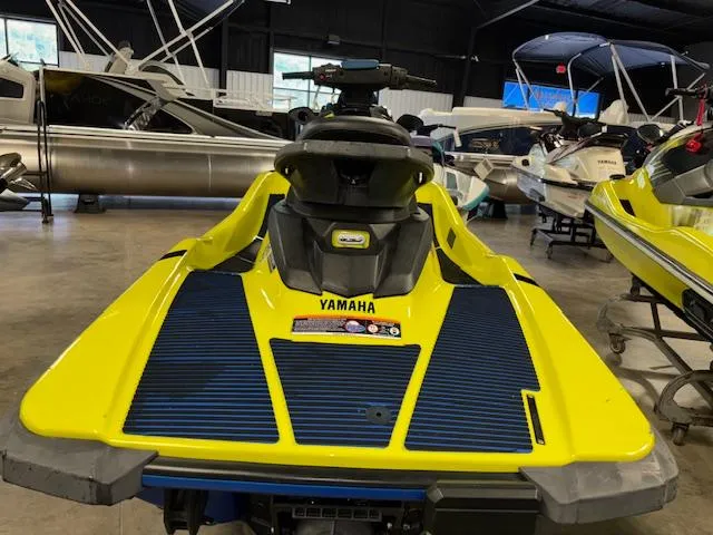 Slide: The Image of 2020 Yamaha WaveRunner EXR in a showroom, featuring a vibrant yellow and blue design. - 6
