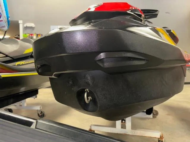 Slide: The Image of 2023 Sea-Doo GTI SE jet ski rear view in showroom setting. - 17