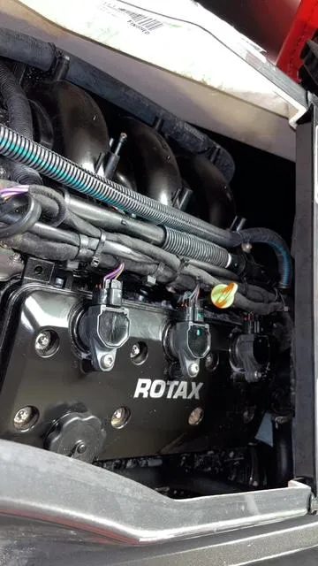 Slide: The Image of 2023 Sea-Doo GTI SE engine featuring a Rotax motor with visible wiring and components. - 18