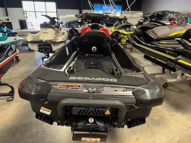 Slide: The Image of 2023 Sea-Doo GTI SE jet ski displayed in a showroom with other models. - 7