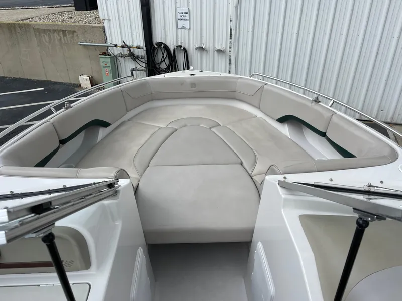 Slide: The Image of 1995 Four Winns 240 Horizon boat interior with spacious seating and clean upholstery. - 18