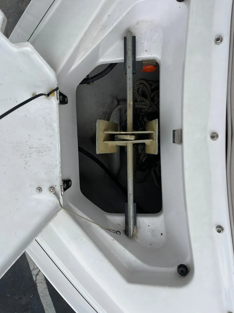 Slide: The Image of Anchor storage compartment on a 1995 Four Winns 240 Horizon boat. - 19