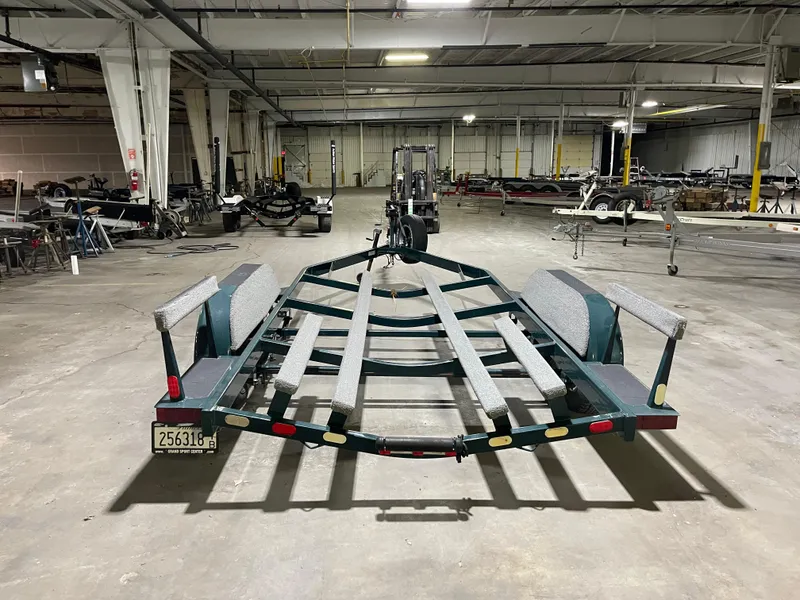 Slide: The Image of Empty boat trailer in a warehouse, suitable for 1995 Four Winns 240 Horizon. - 24