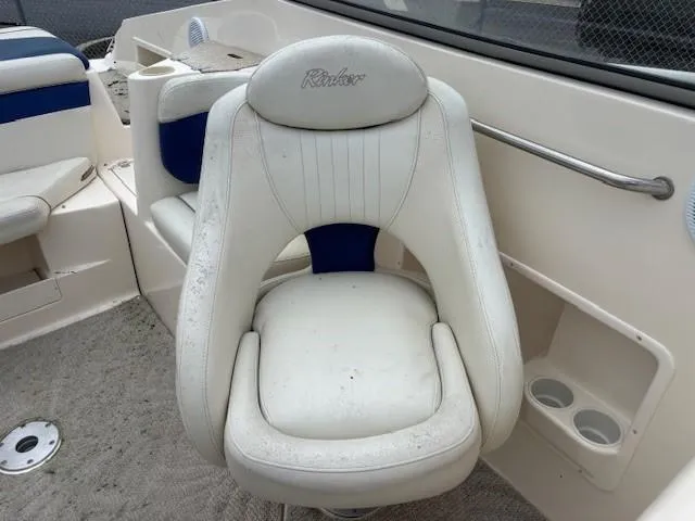 Slide: The Image of 2006 Rinker 232 Captiva Bowrider interior with white and blue seating. - 10