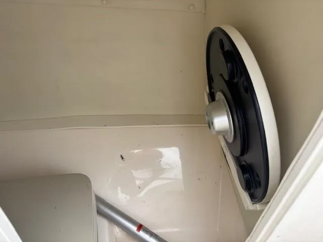 Slide: The Image of Storage compartment in a 2006 Rinker 232 Captiva Bowrider boat. - 14