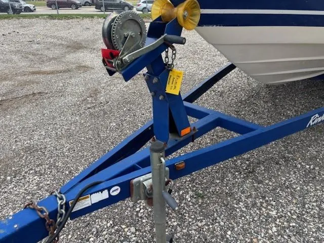 Slide: The Image of 2006 Rinker 232 Captiva Bowrider on blue trailer with winch and hitch. - 31