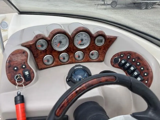 Slide: The Image of Dashboard of 2006 Rinker 232 Captiva Bowrider with gauges and controls. - 4