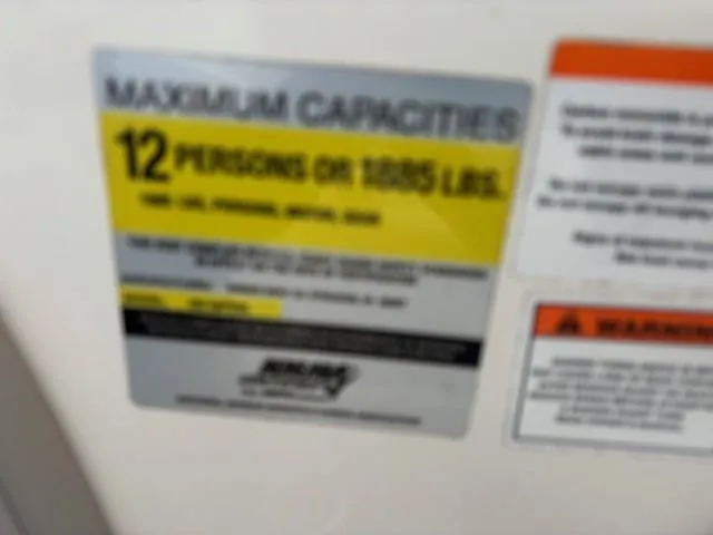 Slide: The Image of Capacity label on 2006 Rinker 232 Captiva Bowrider, max 12 persons or 1805 lbs. - 9
