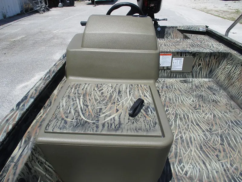 Slide: The Image of 2026 Tracker Grizzly 1648 SC boat interior with camouflage design and steering console. - 13