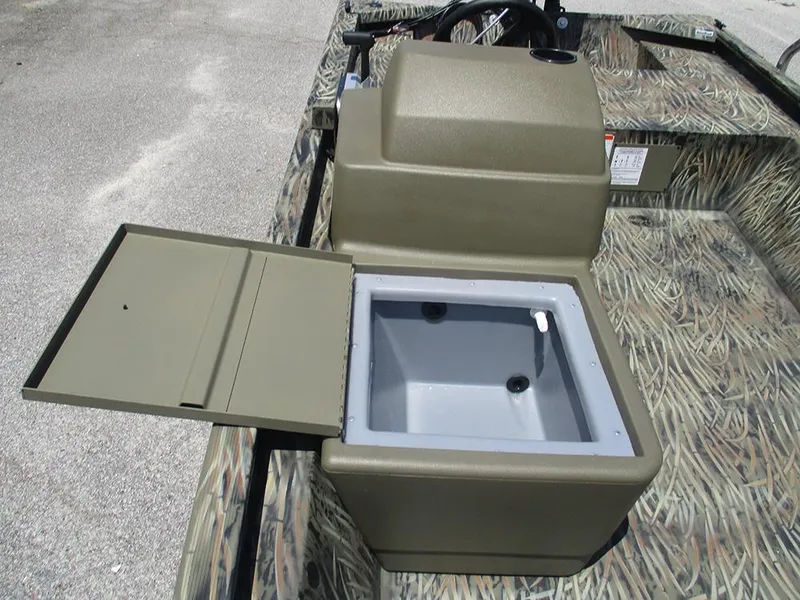 Slide: The Image of 2026 Tracker Grizzly 1648 SC boat with open storage compartment, camo design. - 14