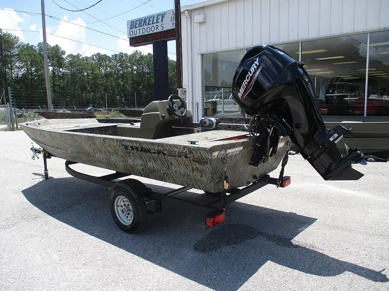 Slide: The Image of 2026 Tracker Grizzly 1648 SC boat with Mercury engine on trailer at dealership. - 3