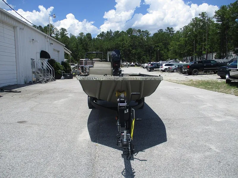 Slide: The Image of 2026 Tracker Grizzly 1648 SC boat on trailer in outdoor parking lot. - 4