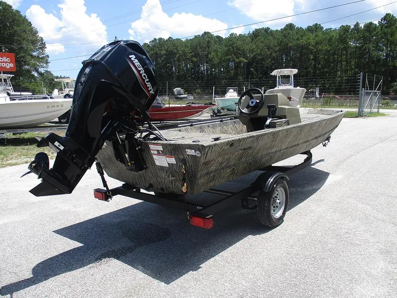 Slide: The Image of 2026 Tracker Grizzly 1648 SC boat with Mercury outboard motor on trailer. - 7