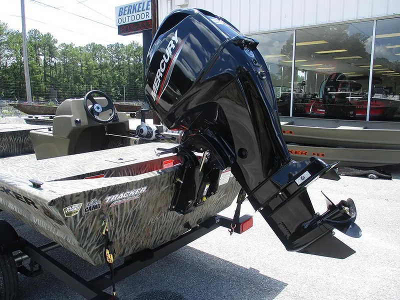Slide: The Image of 2026 Tracker Grizzly 1648 SC boat with Mercury outboard motor at dealership. - 9