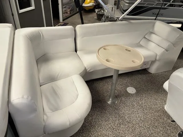 Slide: The Image of White seating area with round table on AquaPatio AP220R boat, 2002 model. - 15