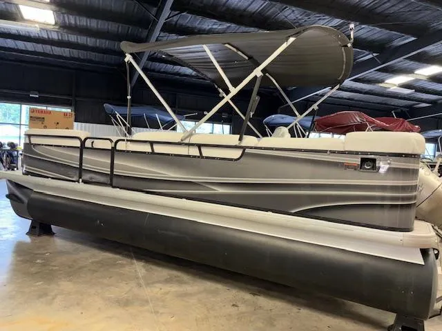 Slide: The Image of 2002 AquaPatio AP220R pontoon boat in indoor storage facility. - 4