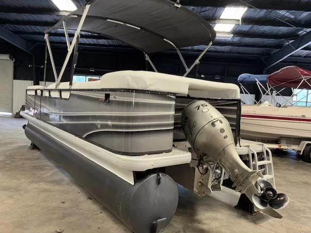 Slide: The Image of 2002 AquaPatio AP220R pontoon boat with canopy in indoor storage. - 5