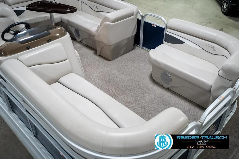 Slide: The Image of 2019 Bennington 18 SLV pontoon boat interior with beige seating and carpeted floor. - 13