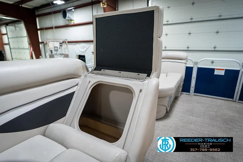 Slide: The Image of 2019 Bennington 18 SLV boat interior with open storage compartment in a showroom. - 22
