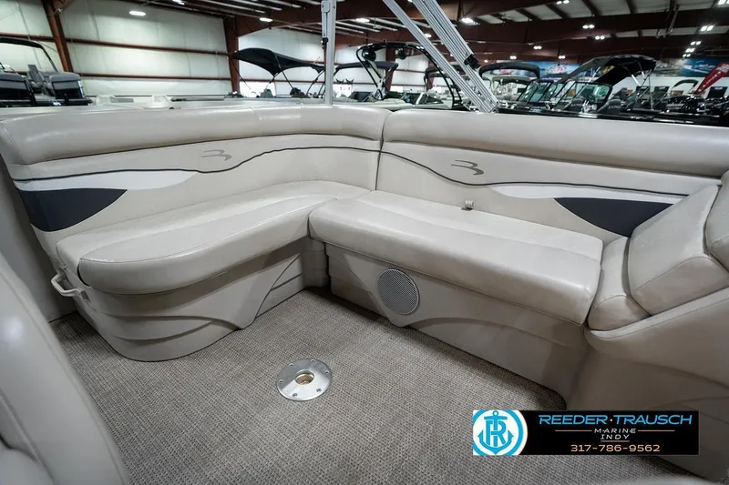Slide: The Image of 2019 Bennington 18 SLV boat interior with beige seating and carpeted floor. - 24