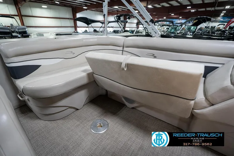 Slide: The Image of 2019 Bennington 18 SLV boat interior with beige seating and carpeted floor. - 25