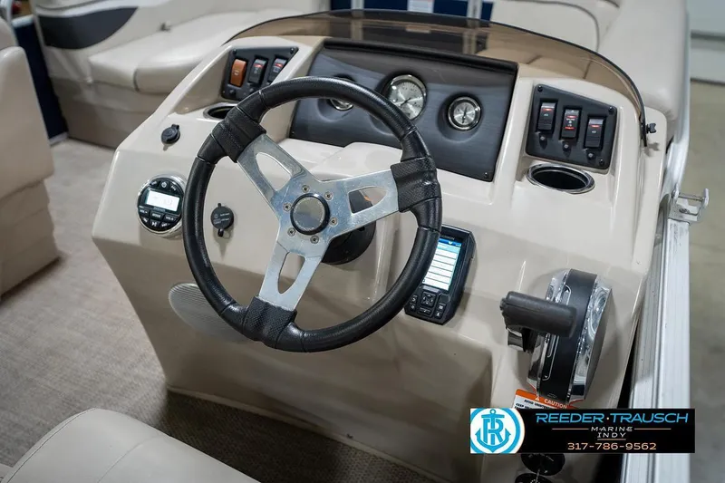 Slide: The Image of 2019 Bennington 18 SLV boat dashboard with steering wheel and control panel. - 29