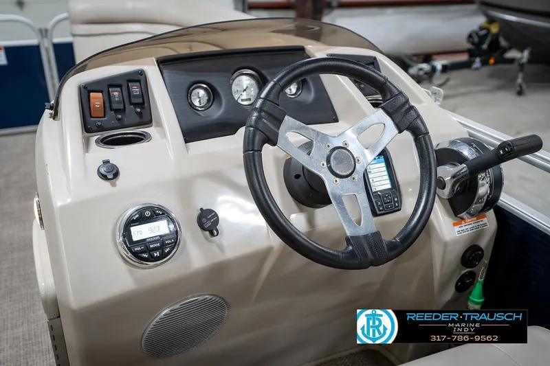 Slide: The Image of 2019 Bennington 18 SLV boat dashboard with steering wheel and control panel. - 30
