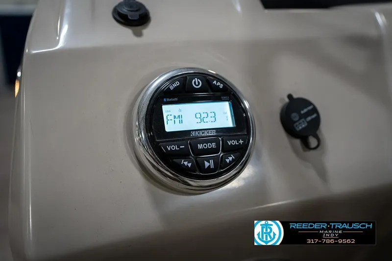 Slide: The Image of 2019 Bennington 18 SLV boat dashboard with Kicker stereo system displaying FM 92.3. - 32