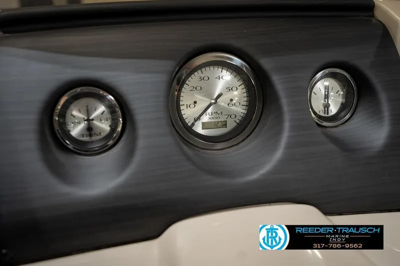 Slide: The Image of Dashboard of 2019 Bennington 18 SLV boat with RPM, trim, and fuel gauges. - 34