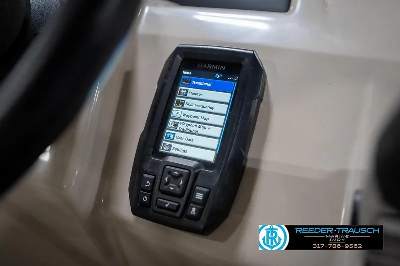 Slide: The Image of Garmin device on 2019 Bennington 18 SLV boat dashboard, displaying navigation options. - 37