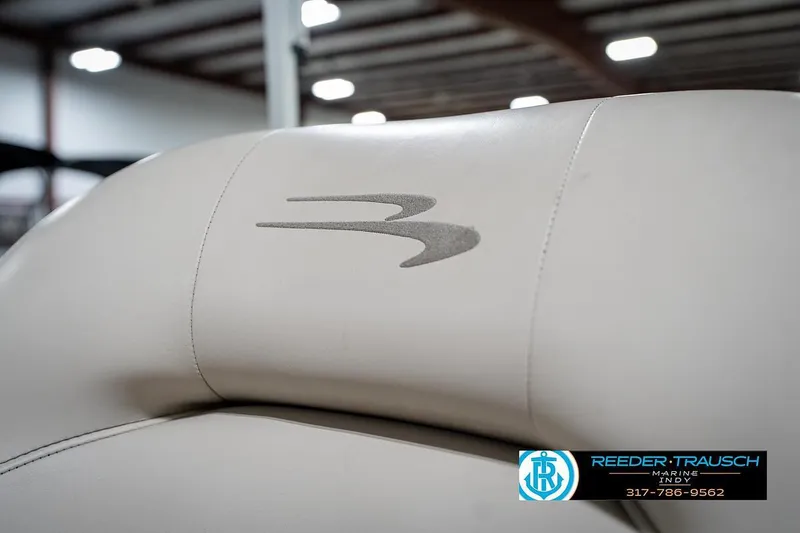 Slide: The Image of 2019 Bennington 18 SLV boat seat with logo, displayed indoors at Reeder Trausch Marine. - 39