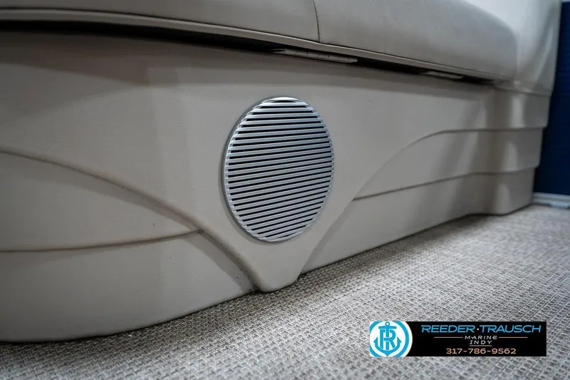 Slide: The Image of Speaker on a 2019 Bennington 18 SLV boat interior, featuring beige upholstery and carpet. - 41