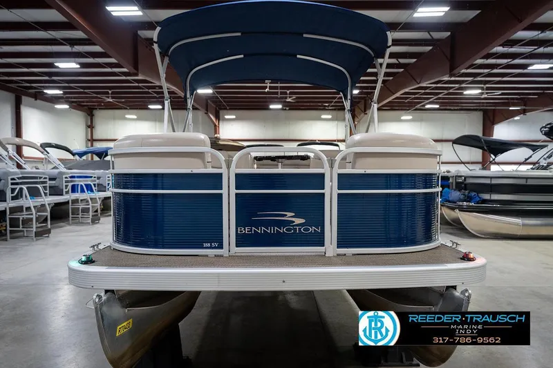 Slide: The Image of 2019 Bennington 18 SLV pontoon boat in showroom, blue and white design, Reeder-Trausch Marine. - 5