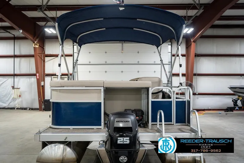 Slide: The Image of 2019 Bennington 18 SLV pontoon boat with Mercury 25 engine in indoor storage. - 9