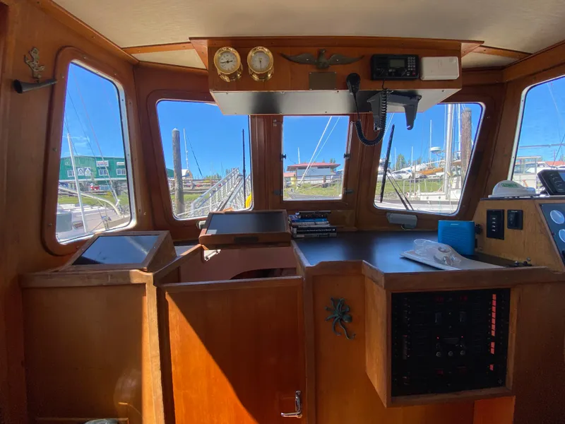 Slide: The Image of 1986 Transpacific Marine Eagle boat interior with navigation equipment and wooden finish. - 15