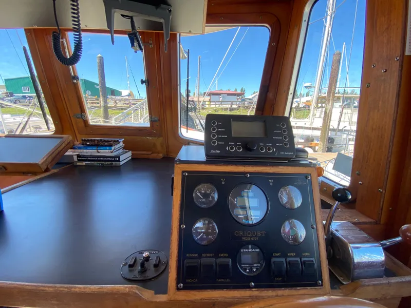 Slide: The Image of 1986 Transpacific Marine Eagle boat cockpit with navigation instruments and control panel. - 18