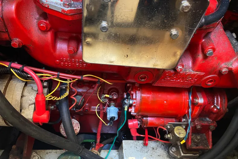 Slide: The Image of Close-up of a 1986 Transpacific Marine Eagle engine with red components and wiring. - 26