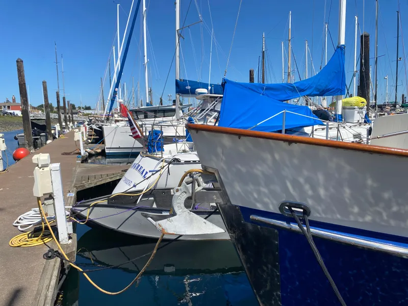 Slide: The Image of Boats docked at marina, featuring 1986 Transpacific Marine Eagle sailboat. - 4