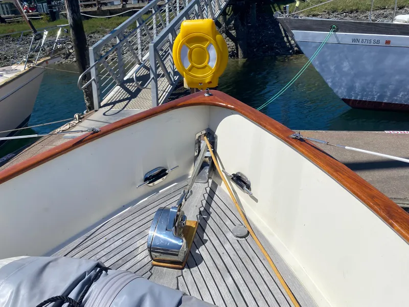 Slide: The Image of 1986 Transpacific Marine Eagle boat deck with anchor and safety equipment at dock. - 6