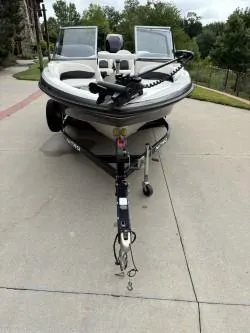 Slide: The Image of 2011 Nitro Z 290 Sport boat on trailer, parked on concrete driveway. - 4
