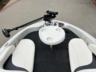 Slide: The Image of 2011 Nitro Z 290 Sport boat interior with white seating and control panel. - 5