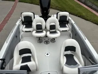 Slide: The Image of 2011 Nitro Z 290 Sport boat interior with six white and black seats. - 6
