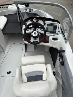 Slide: The Image of 2011 Nitro Z 290 Sport boat interior with steering wheel and dashboard controls. - 7