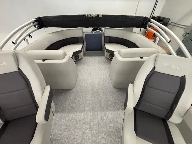 Slide: The Image of 2025 Harris Cruiser 230 CWDH interior with plush seating and modern design. - 10