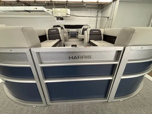 Slide: The Image of 2025 Harris Cruiser 230 CWDH pontoon boat with spacious seating and modern design. - 16