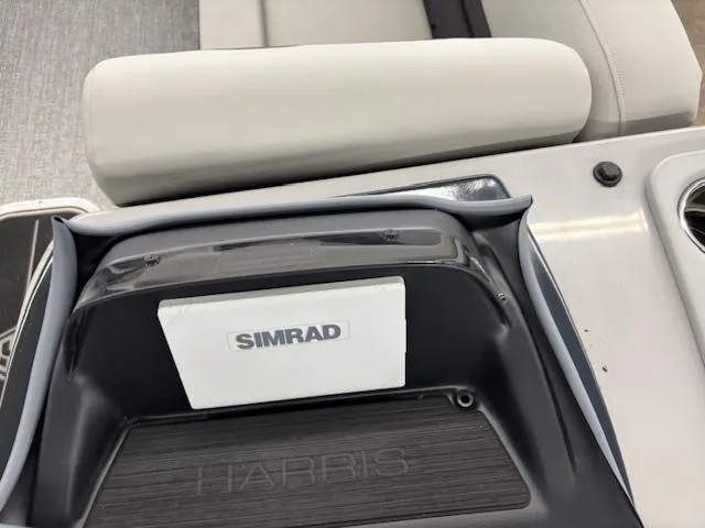 Slide: The Image of 2025 Harris Cruiser 230 CWDH boat dashboard with Simrad navigation system. - 17