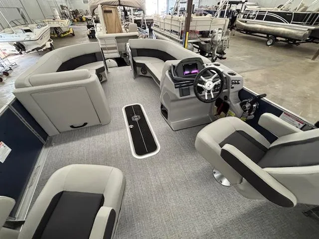 Slide: The Image of 2025 Harris Cruiser 230 CWDH pontoon boat interior with modern seating and steering console. - 7
